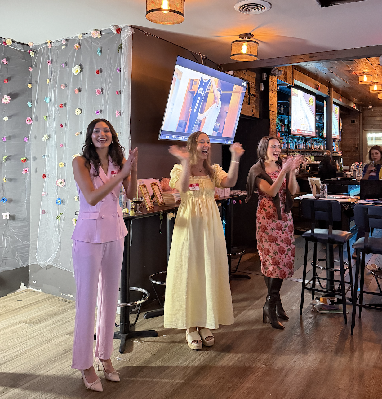 Three women celebrating together at an event
